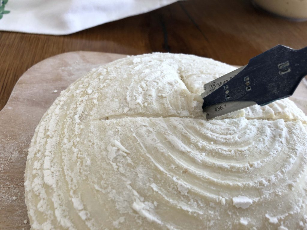 turn the dough 90 degrees and cut halfway