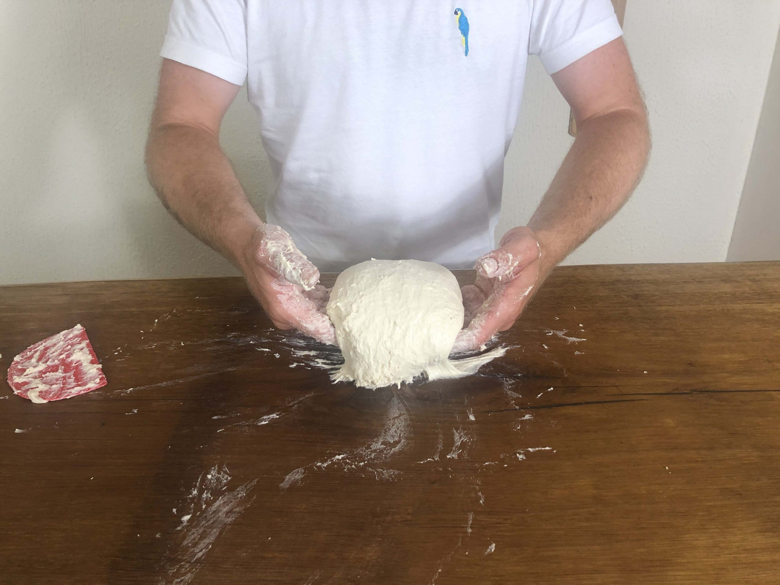 Lift it up with a hand on each side of the mass