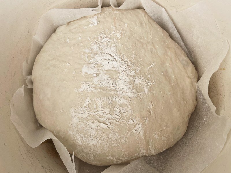 Drop the bread into the dutch oven carefully