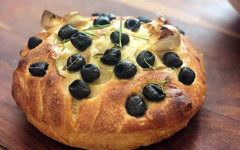 olives, garlic and rosemary on a focaccia